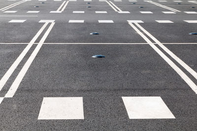 High angle view of arrow symbol on road