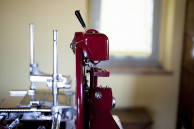 Close-up of red camera on table