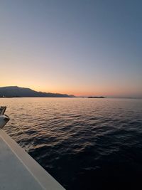 Scenic view of sea against clear sky during sunset