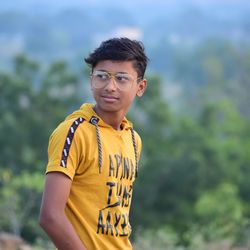 Portrait of young man standing outdoors