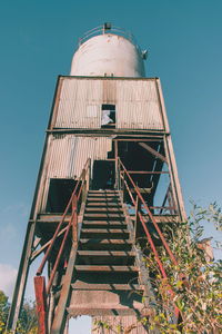 Low angle view of water tower against clear sky