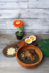 High angle view of ribs soup in bowl on table