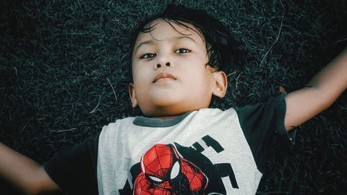 Portrait of cute boy lying down