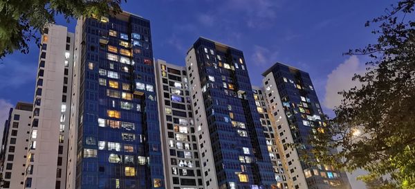 Low angle view of buildings against blue sky