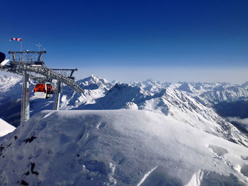 Low angle view of ski lift against sky