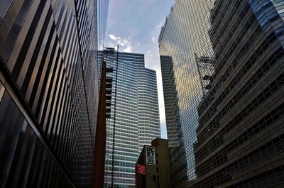 Low angle view of modern buildings against sky