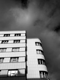 Low angle view of building against cloudy sky