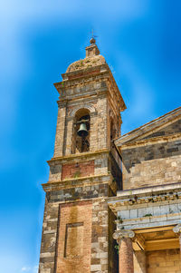 Low angle view of historical building against blue sky