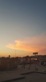 Silhouette buildings against sky during sunset