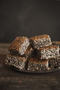 Close-up of cake on table against black background