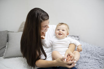 Portrait of mother and daughter at home