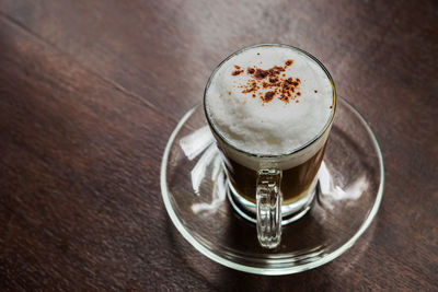 High angle view of coffee cup on table