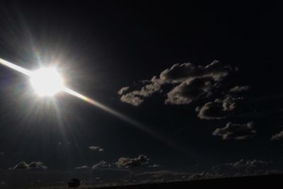 Low angle view of sun in sky