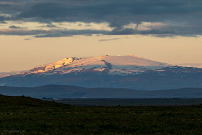 Scenic view of landscape against sky during sunset