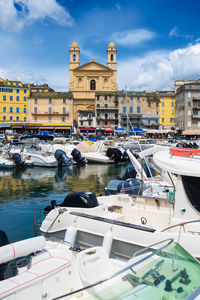 View on église saint jean-baptiste in bastia from the vieux port with boats resting in the habour