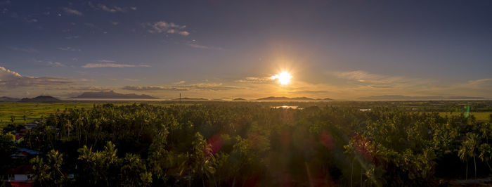 Panoramic view of landscape against sky during sunset