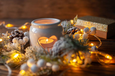 Close-up of illuminated christmas decorations on table