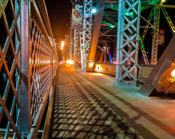 Illuminated bridge at night