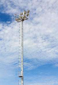 Low angle view of communications tower against sky