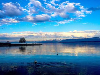 Reflection of clouds in calm lake