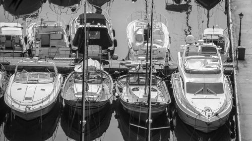 Boats moored at harbor