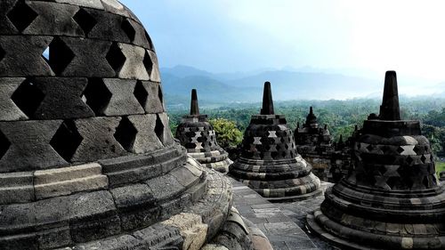 Ancient temple against sky