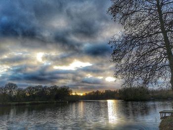 Scenic view of lake against sky during sunset