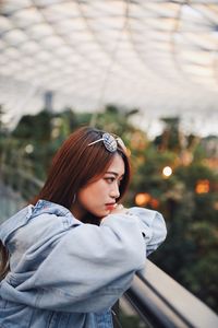 Portrait of young woman looking at camera