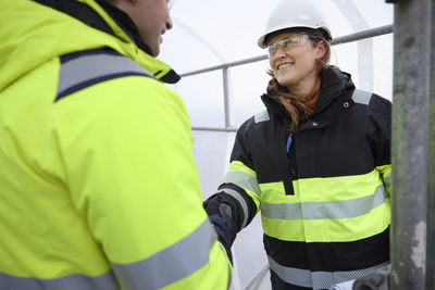 Engineers having handshake at building site