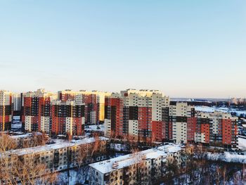 High angle view of buildings against clear sky during winter