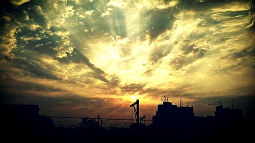 Silhouette of men at sunset