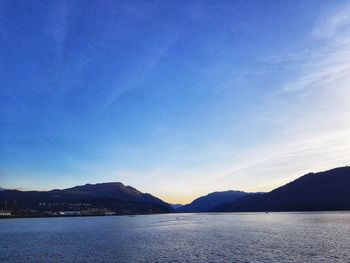 Scenic view of lake against blue sky