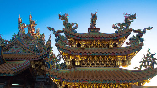 Low angle view of traditional building against sky