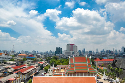 High angle view of buildings in city against sky