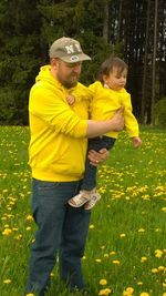 Person standing on grassy field