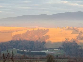 Scenic view of field against sky during sunset