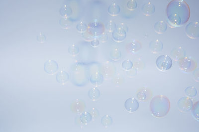 Close-up of bubbles against white background