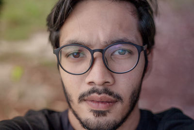 Portrait of young man wearing eyeglasses