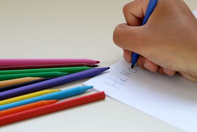 Close-up of hand holding pencils