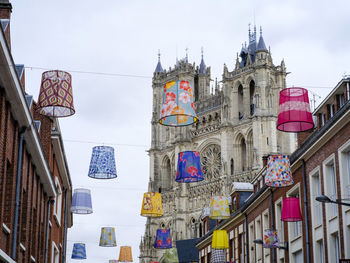 Low angle view of buildings in city against sky