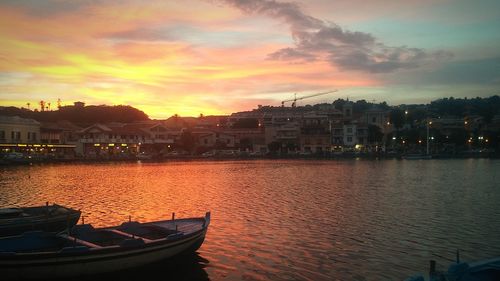 Boat in river at sunset