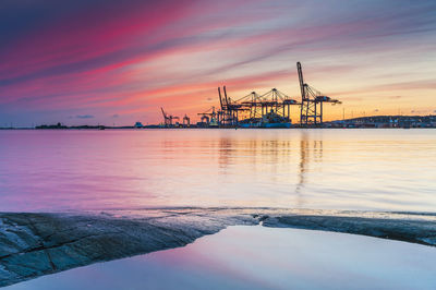 Cranes and ships at sunset, sweden