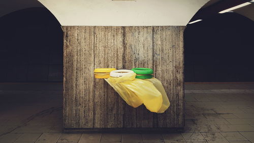 Yellow umbrella on wooden floor