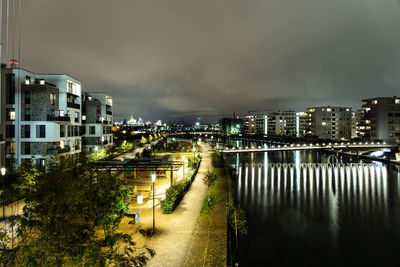 High angle view of illuminated city buildings at night