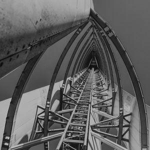 Low angle view of ferris wheel against sky