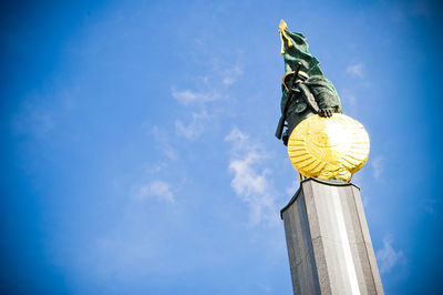 Low angle view of building against blue sky