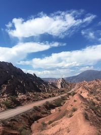 Scenic view of landscape and mountains against sky