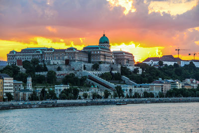 View of buildings against sky at sunset