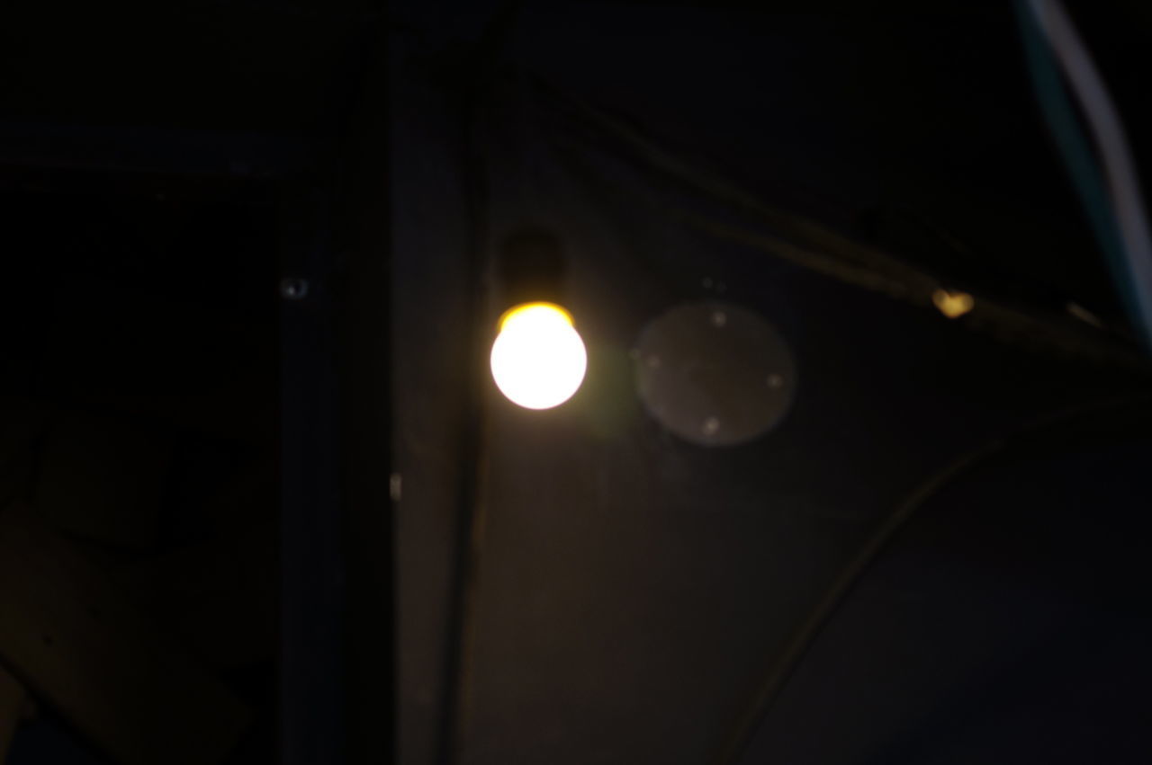 CLOSE-UP OF ILLUMINATED LIGHTING EQUIPMENT