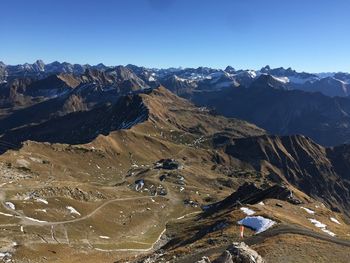 High angle view of snowcapped mountains against clear sky
